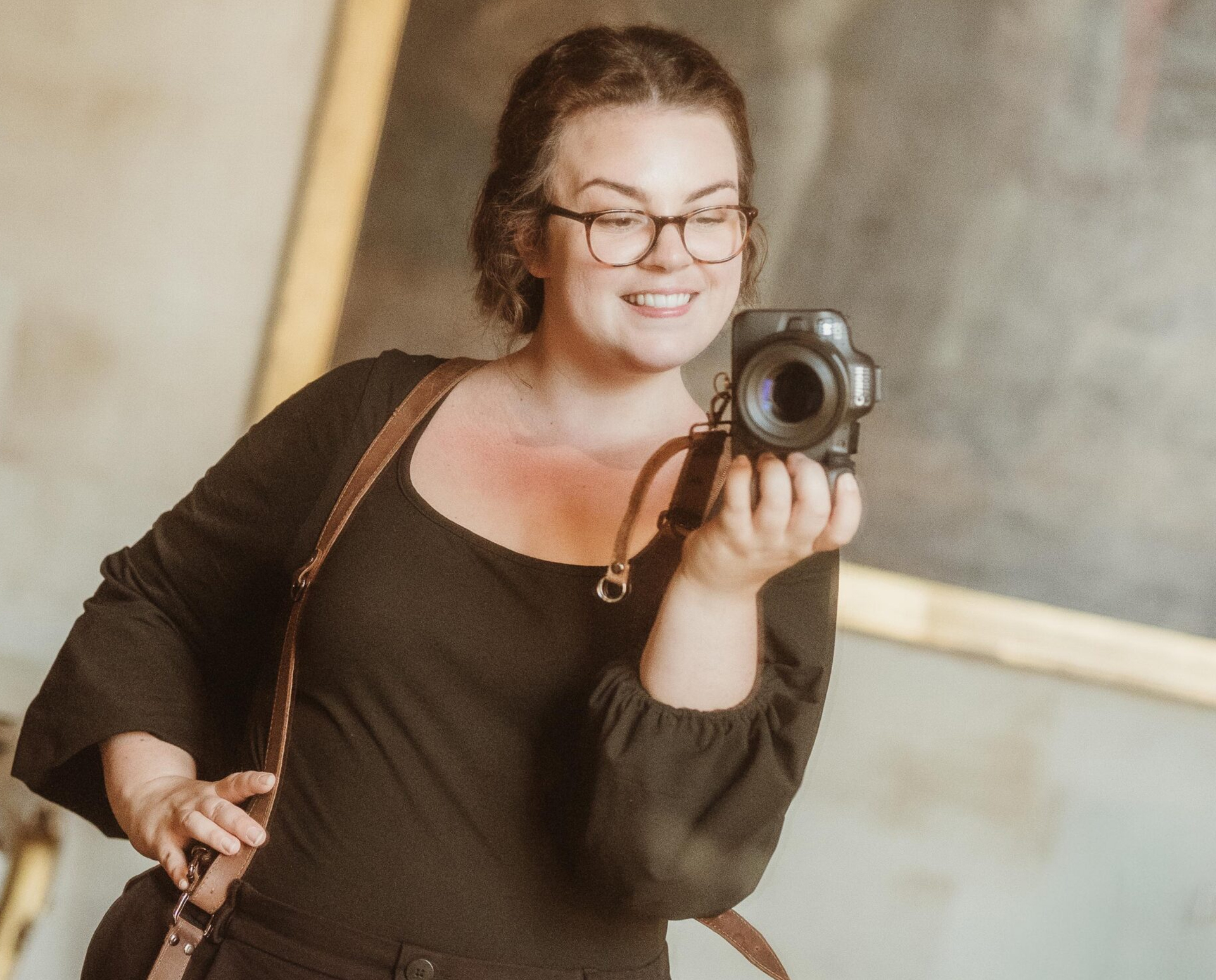 Emma Marshall holding a camera